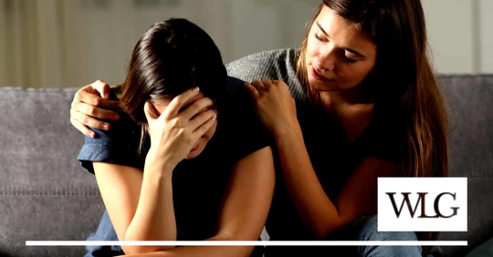 sad girl with mom comforting her