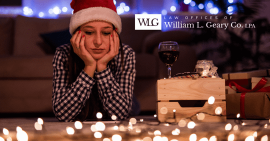 Person sitting on floor looking at lights.