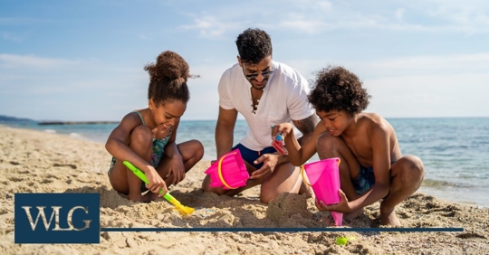 Kids and parent at beach.