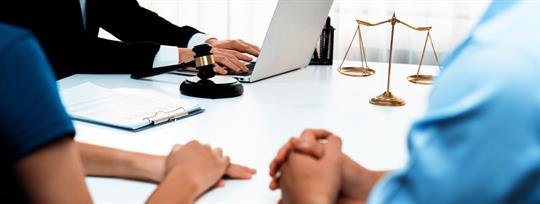 divorcing couple consulting with a lawyer