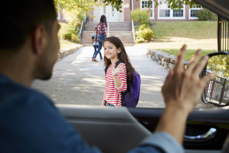 father dropping off daughter at school
